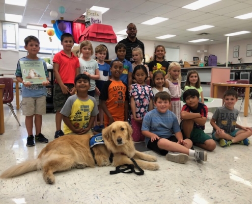 Anderson Elementary book drive winners with Patriot
